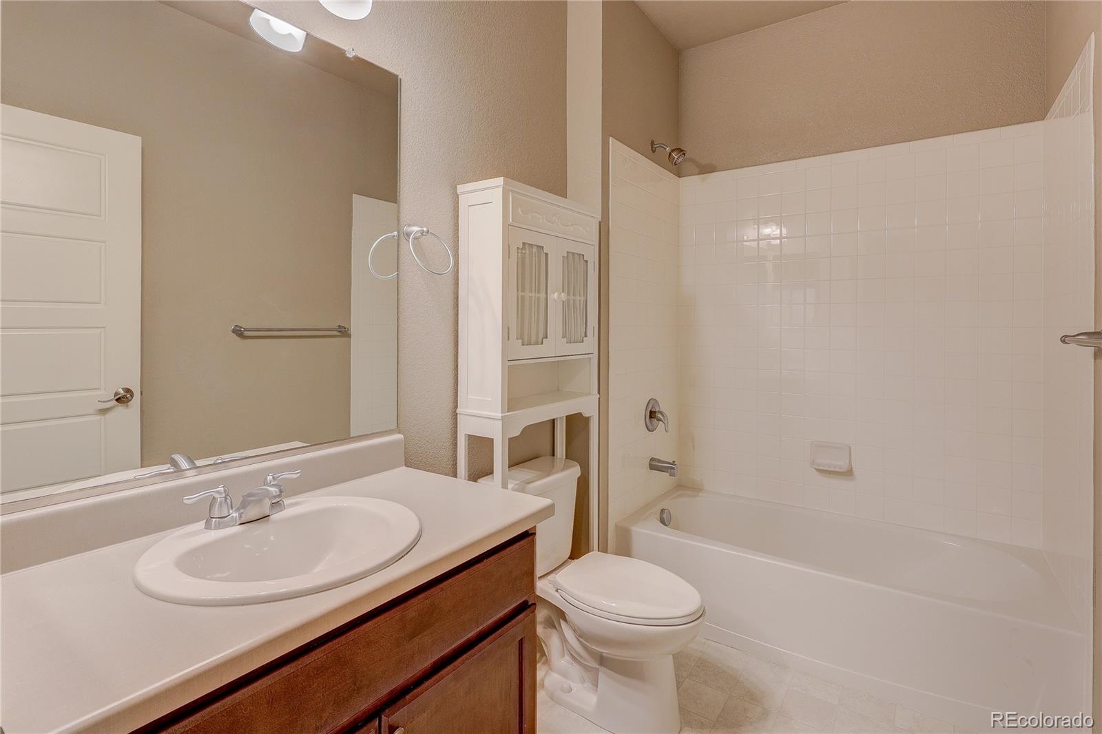 8891 Foxfire Street Firestone, CO 80504 - Photo 7 of 37 a bathroom with a sink a toilet and shower