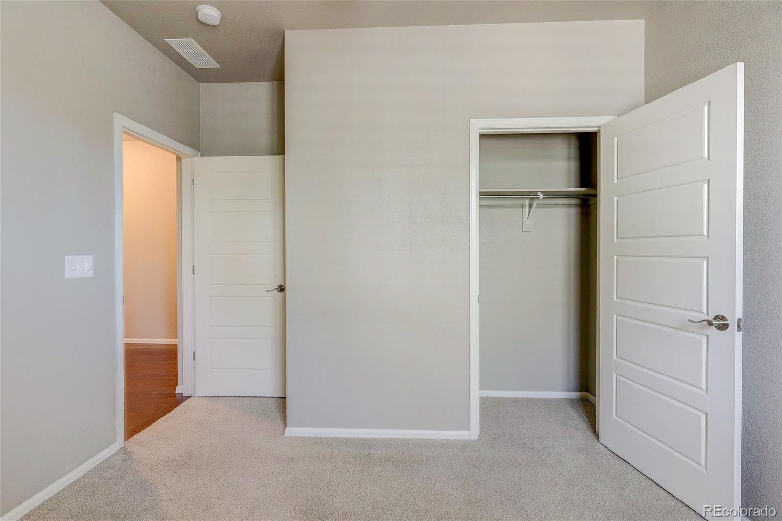 8891 Foxfire Street Firestone, CO 80504 - Photo 8 of 37 wooden floor and closet in an empty room