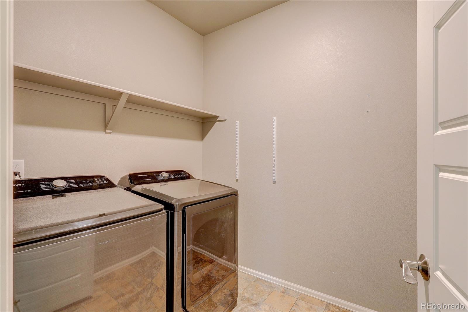 8891 Foxfire Street Firestone, CO 80504 - Photo 10 of 37 a utility room with dryer and washer