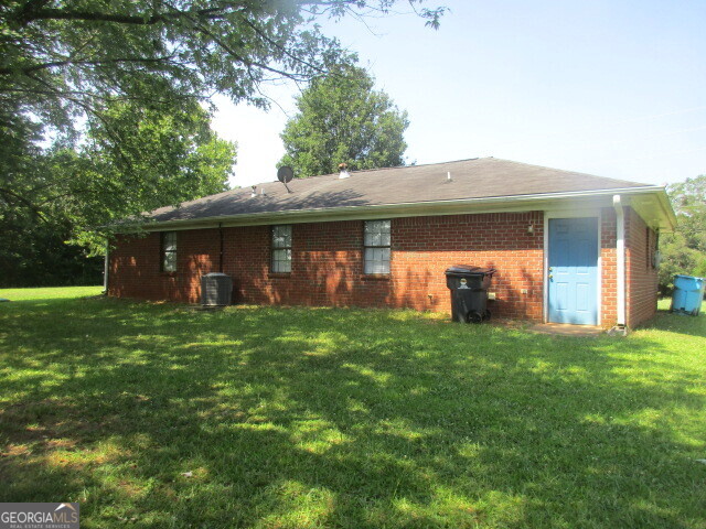 625 Strickland Road Locust Grove, GA 30248 - Photo 2 of 11 a front view of a house with yard