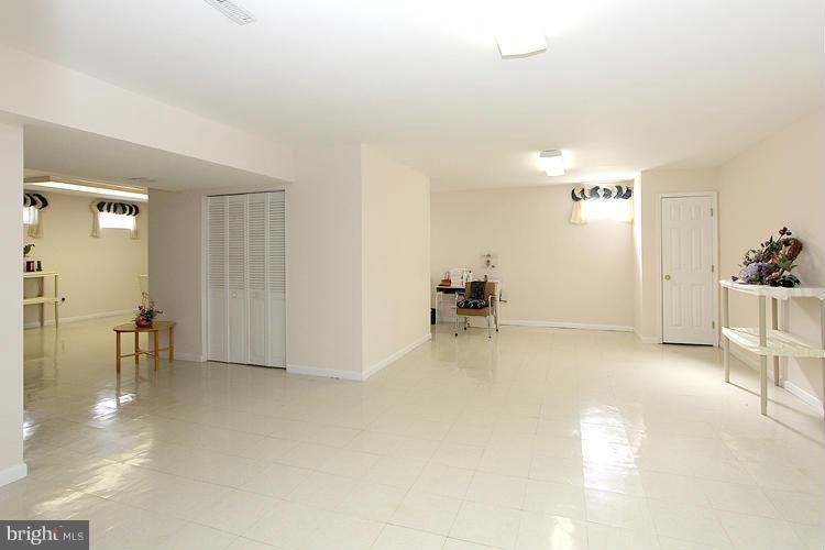 15619 Thompson Road Silver Spring, MD 20905 - Photo 23 of 27 Play or Living Area w/LRGE Storage Room