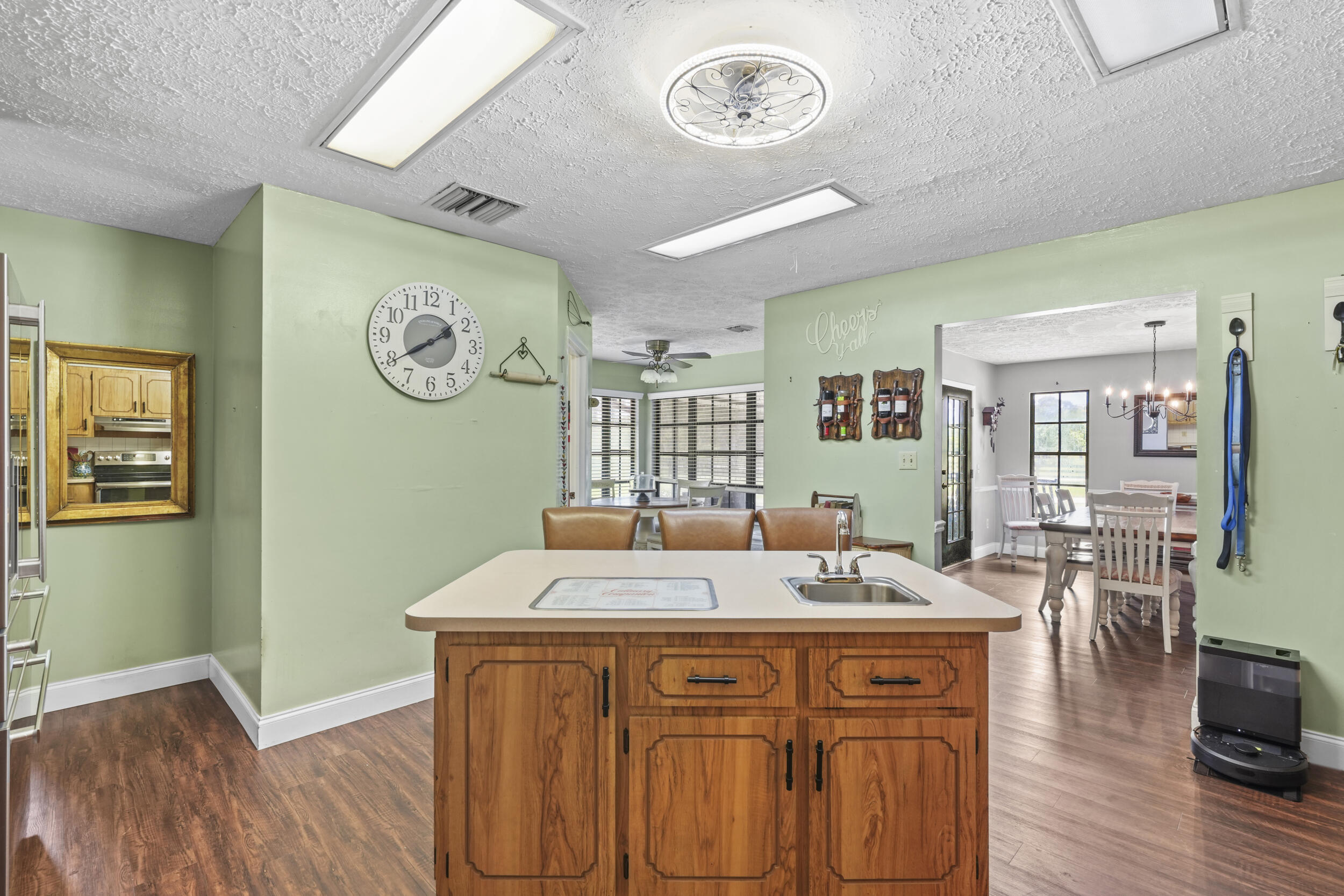4170 McCarty Road Fort Pierce, FL 34945 - Photo 14 of 57 a view of a dining room with furniture and wooden floor