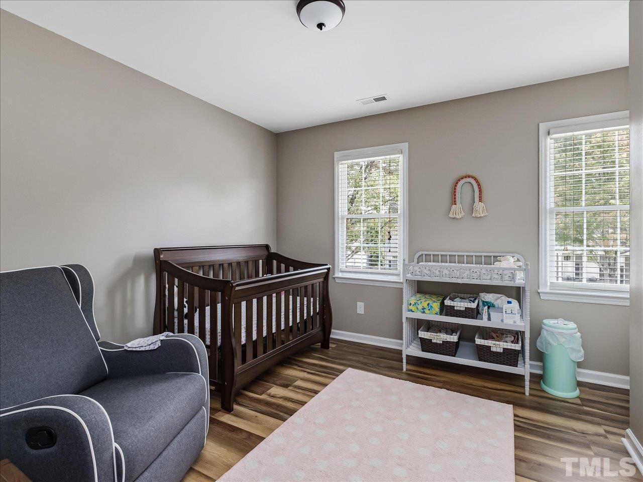 11220 North Radner Way Raleigh, NC 27613 - Photo 18 of 24 a bedroom with furniture and a window