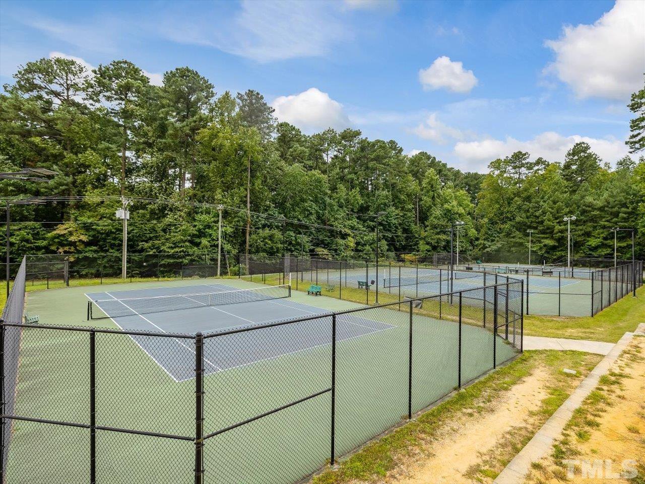 11220 North Radner Way Raleigh, NC 27613 - Photo 24 of 24 a view of a swimming pool with a yard