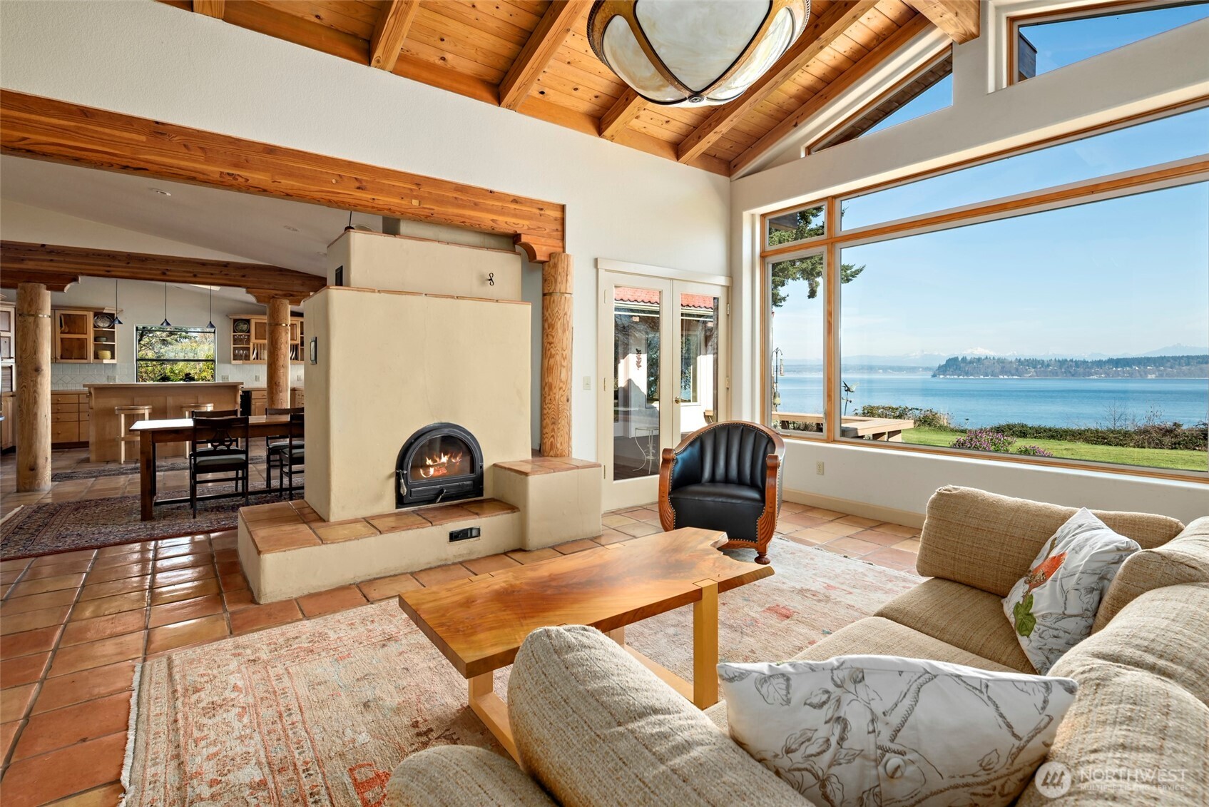 5477 Wilkinson Road Langley, WA 98260 - Photo 11 of 40 a living room with furniture a rug and a floor to ceiling window