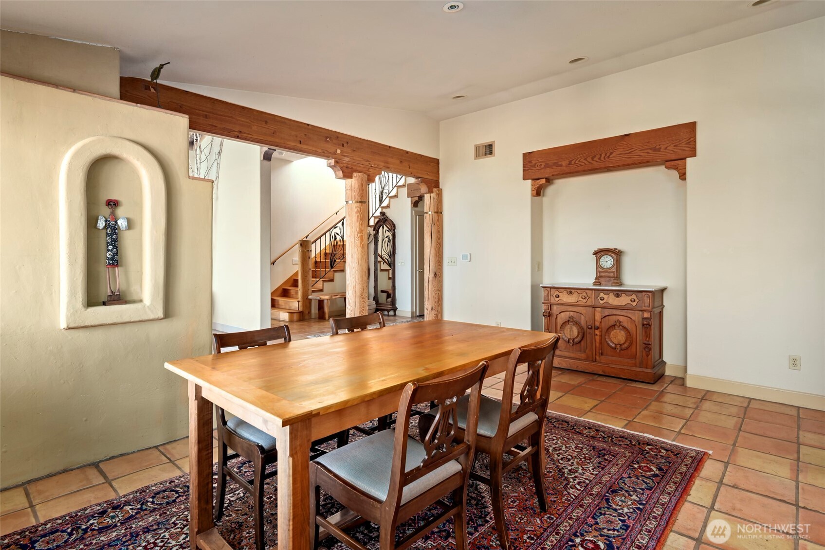 5477 Wilkinson Road Langley, WA 98260 - Photo 13 of 40 a view of a dining room with furniture window and wooden floor