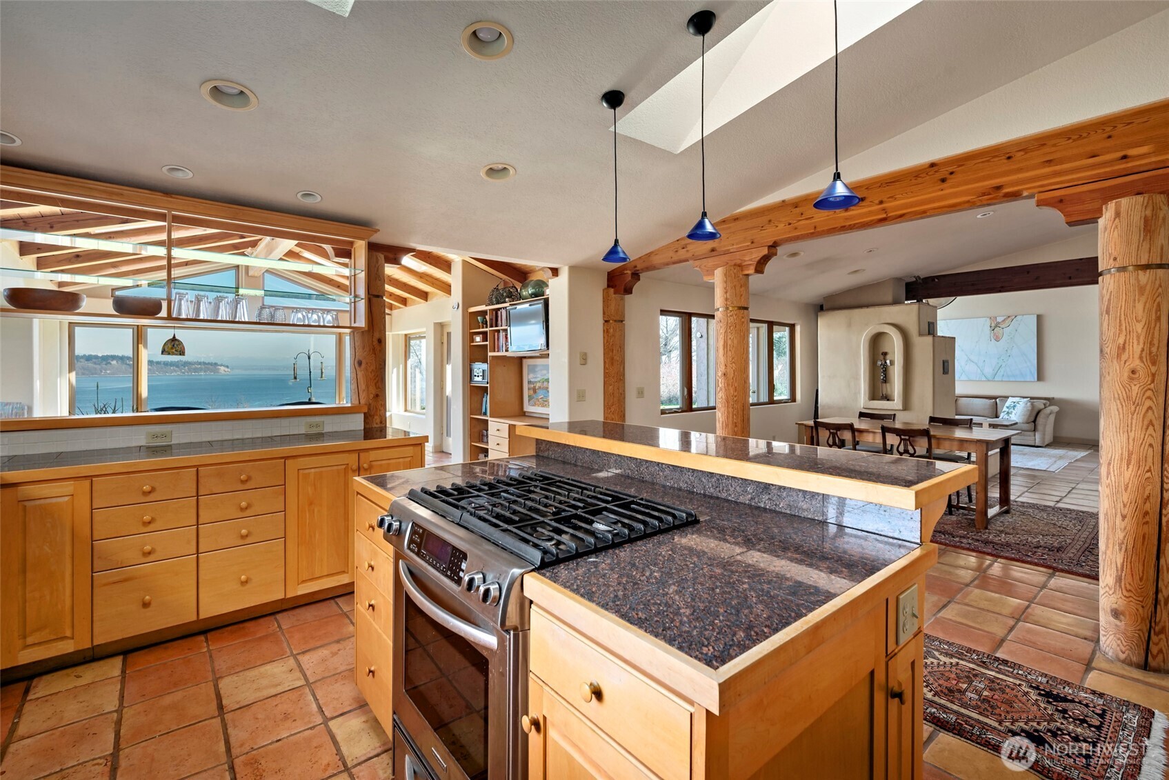 5477 Wilkinson Road Langley, WA 98260 - Photo 17 of 40 a kitchen that has a lot of cabinets in it