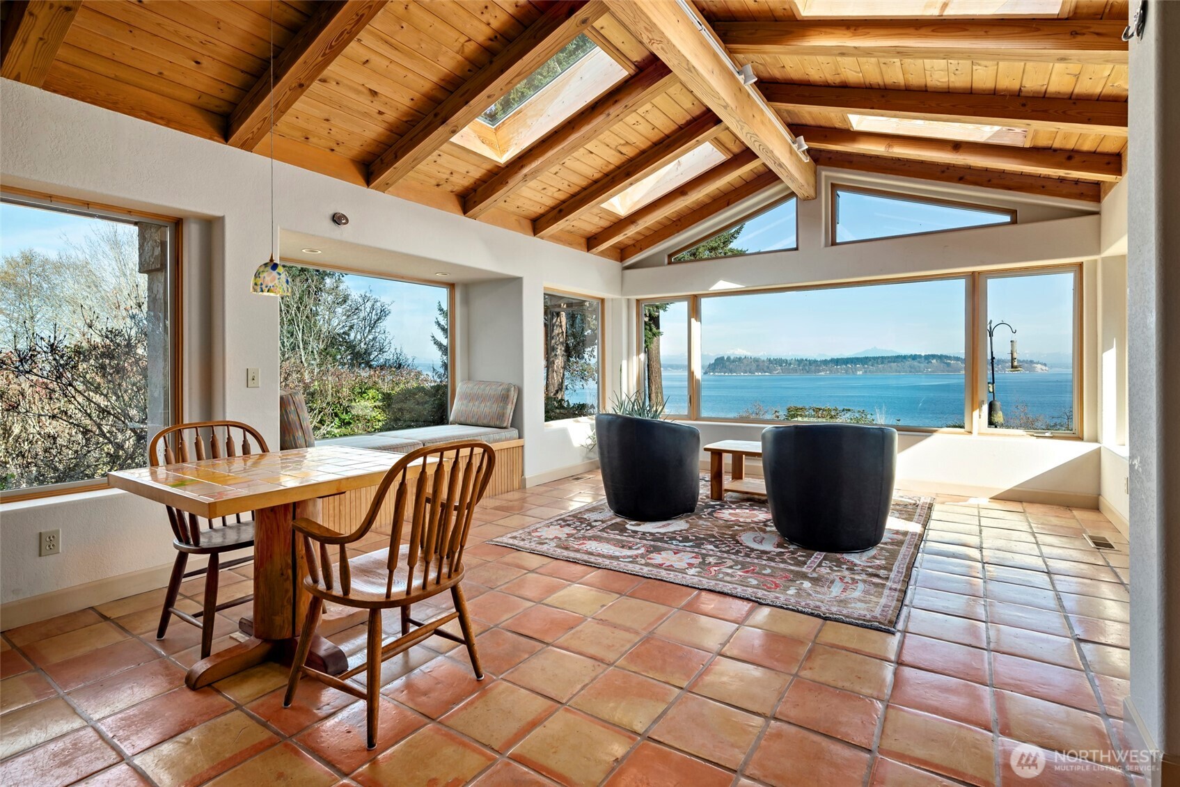 5477 Wilkinson Road Langley, WA 98260 - Photo 18 of 40 a view of a patio with table and chairs