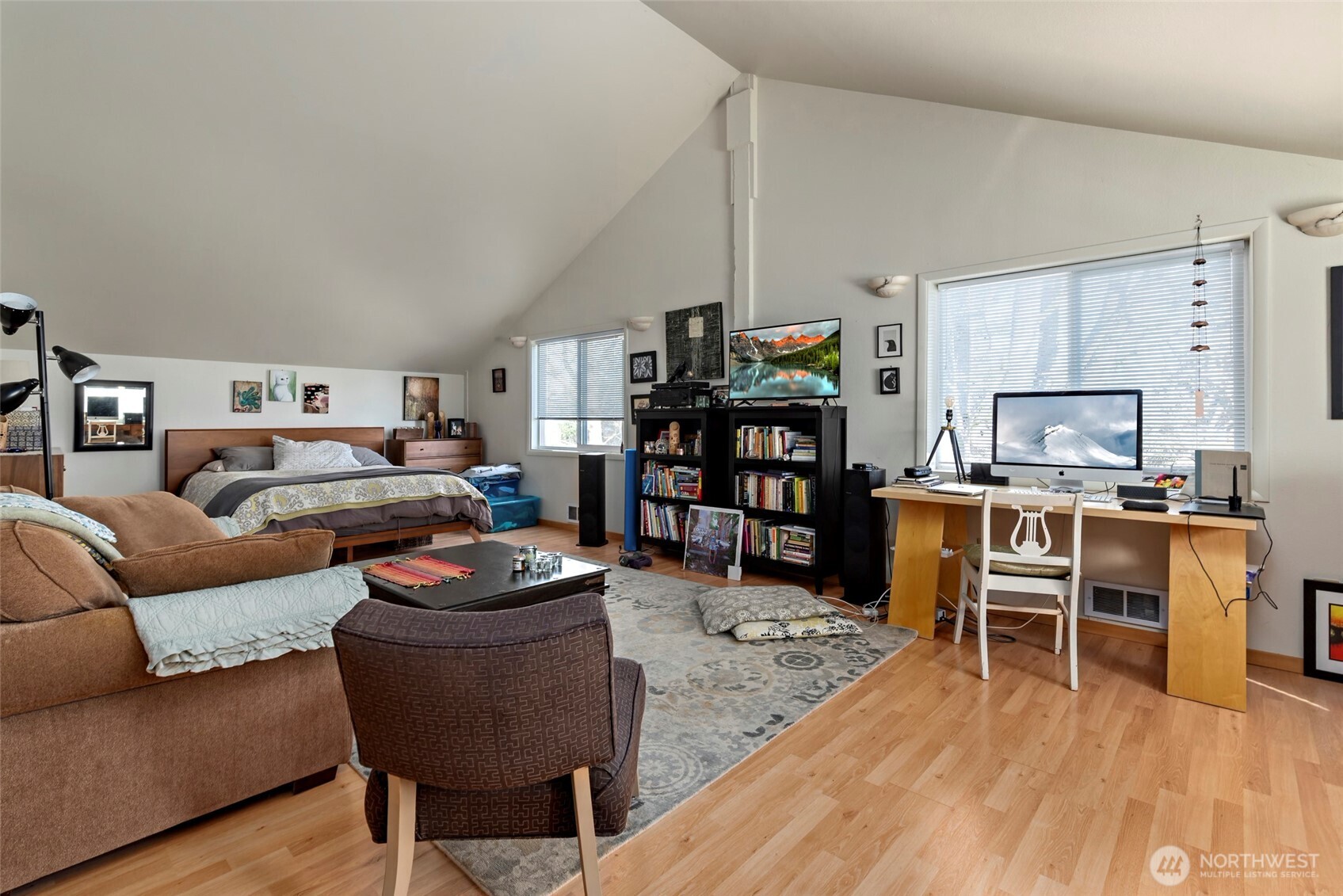 5477 Wilkinson Road Langley, WA 98260 - Photo 34 of 40 a living room with furniture kitchen view and a wooden floor
