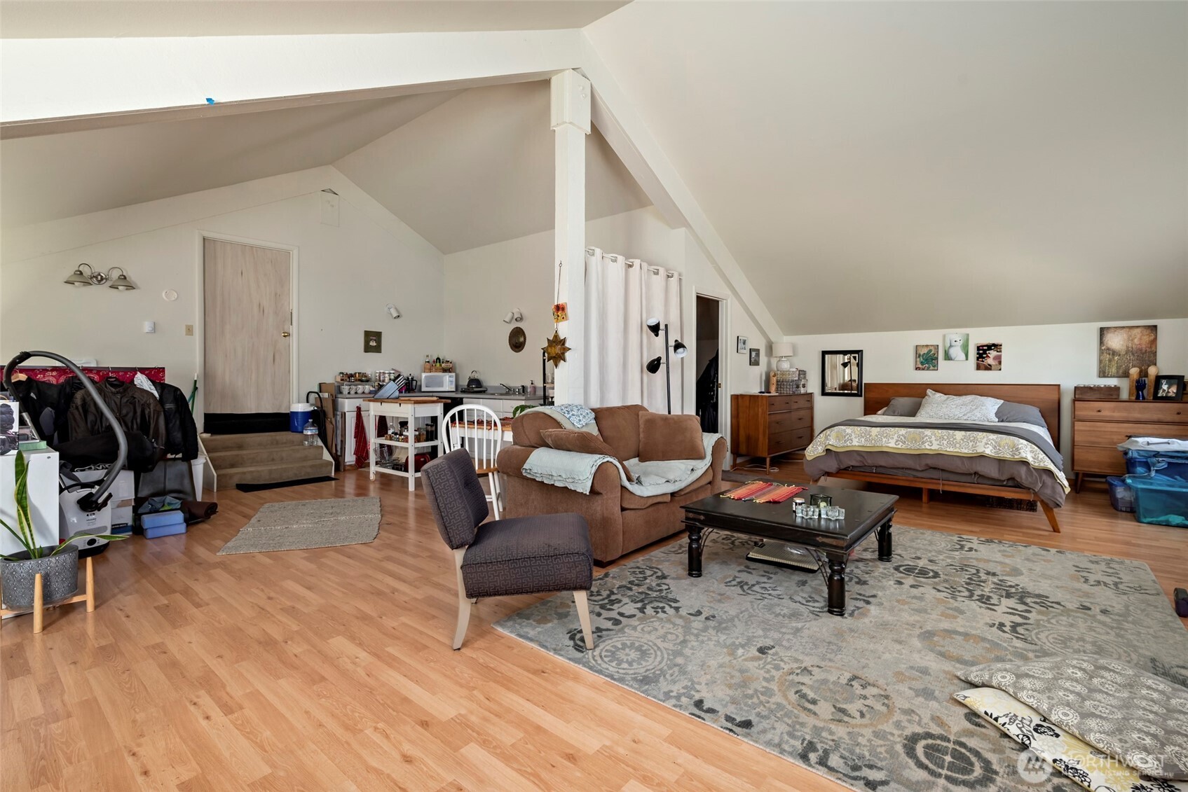 5477 Wilkinson Road Langley, WA 98260 - Photo 35 of 40 a living room with furniture a rug and gym equipment