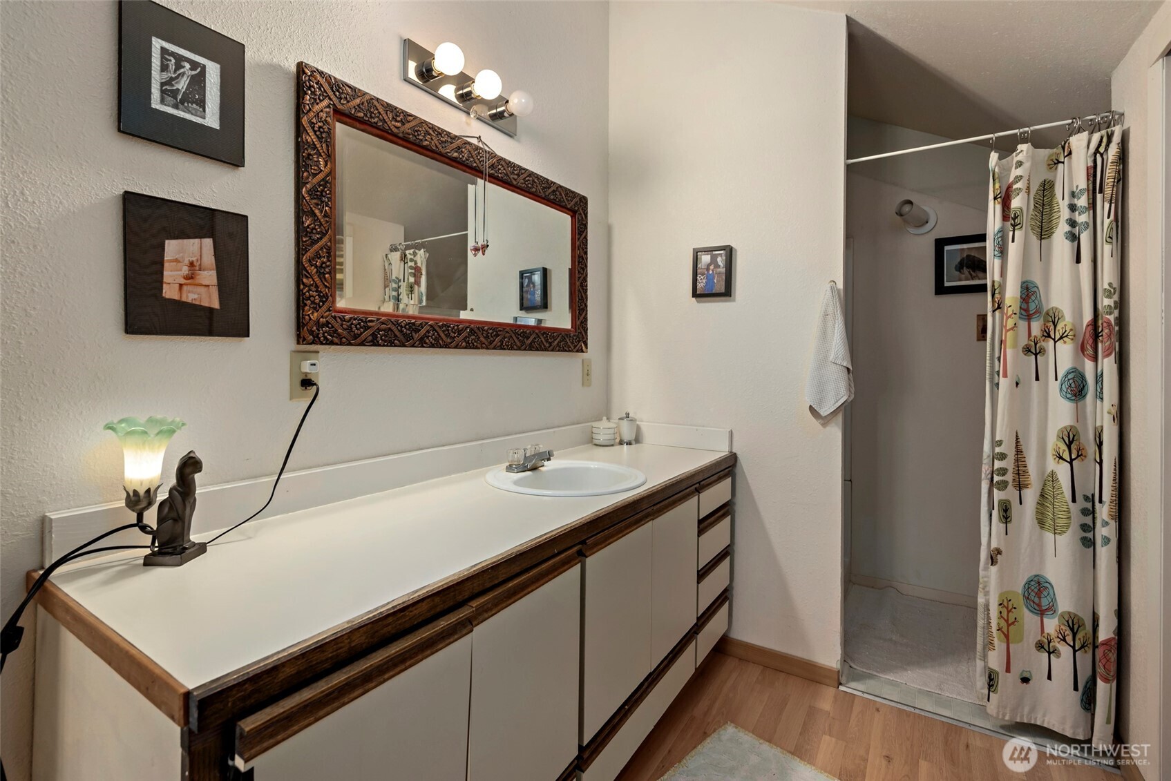5477 Wilkinson Road Langley, WA 98260 - Photo 36 of 40 a bathroom with a sink and a mirror