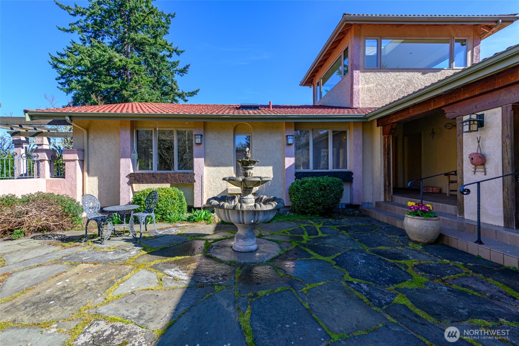 5477 Wilkinson Road Langley, WA 98260 - Photo 4 of 40 a front view of a house with seating space