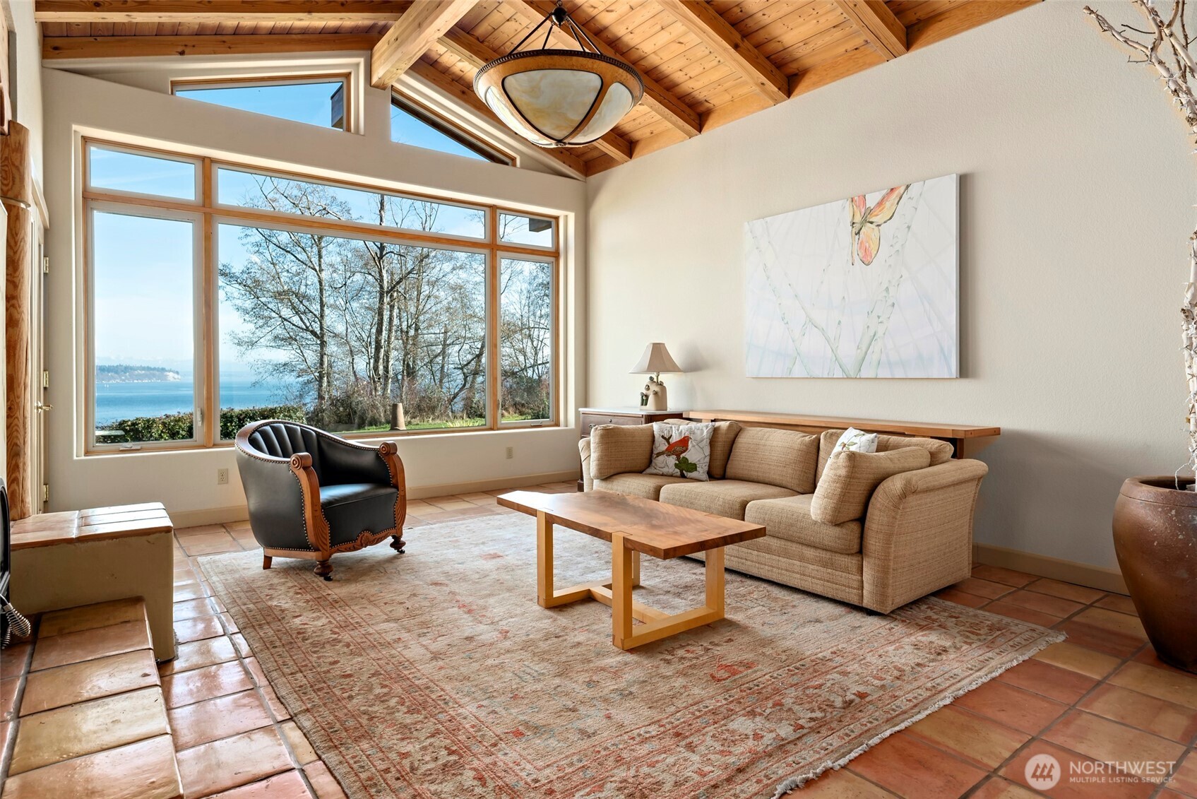 5477 Wilkinson Road Langley, WA 98260 - Photo 10 of 40 a living room with furniture and a floor to ceiling window