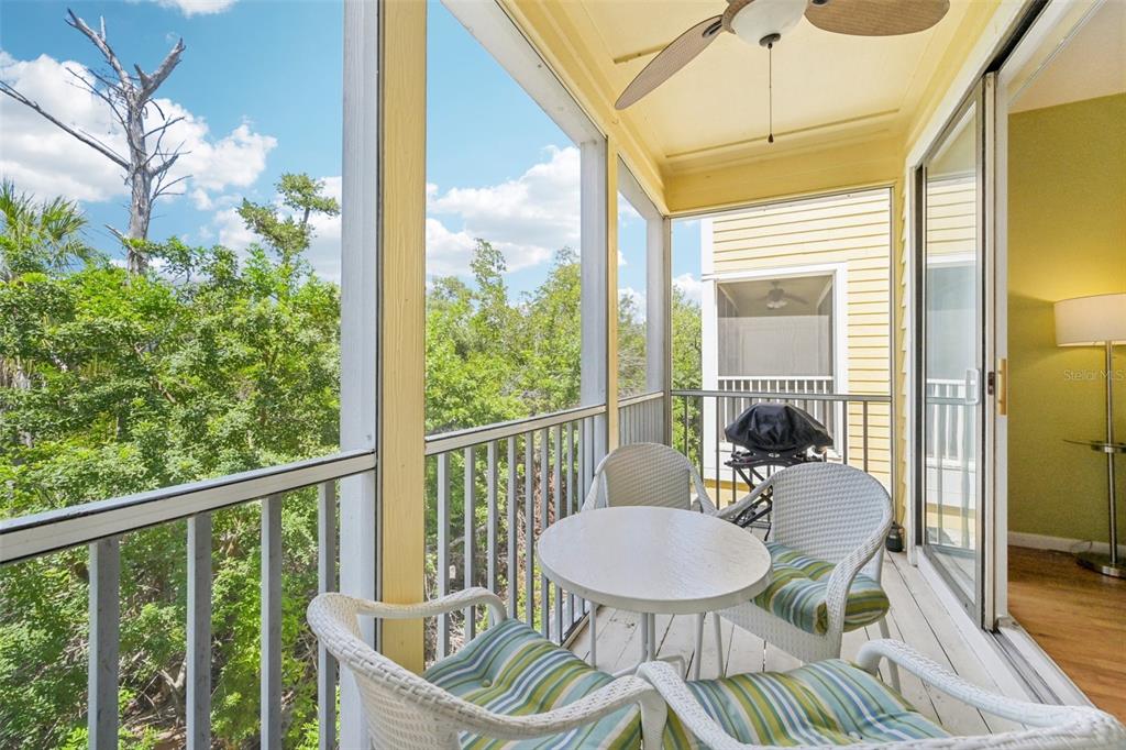 660 Cedars Court Longboat Key, FL 34228 - Photo 23 of 35 a outdoor dining space with furniture water view and a window