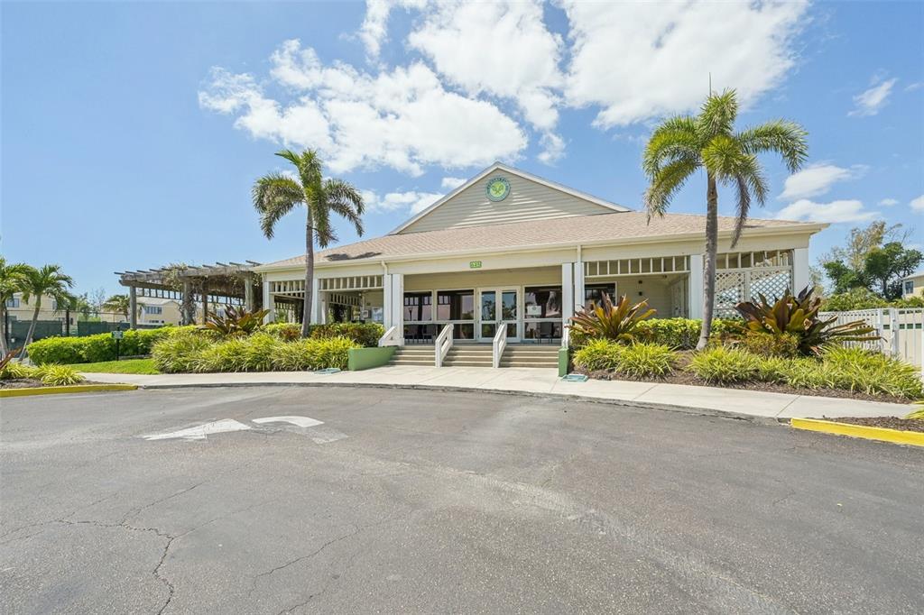 660 Cedars Court Longboat Key, FL 34228 - Photo 27 of 35 a front view of a house with a yard and a garage