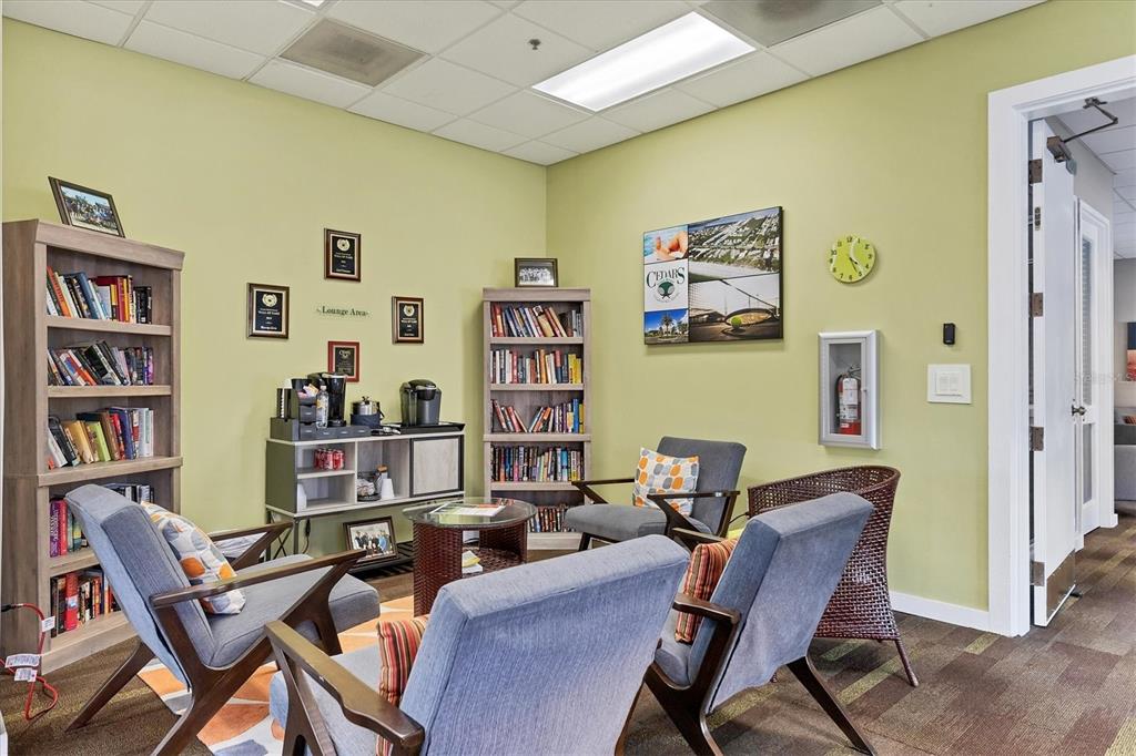 660 Cedars Court Longboat Key, FL 34228 - Photo 28 of 35 a work room with furniture and a bookshelf