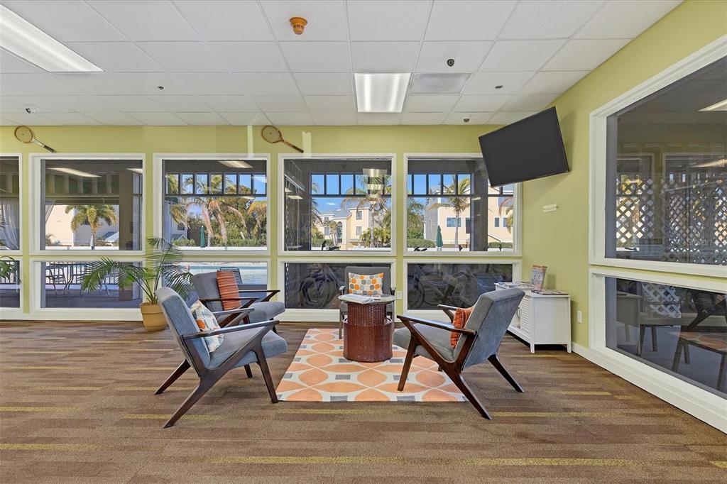 660 Cedars Court Longboat Key, FL 34228 - Photo 29 of 35 a living room with furniture and a floor to ceiling window