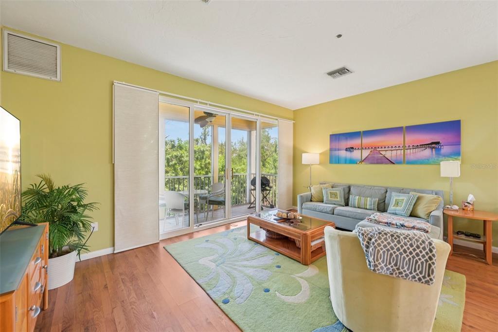 660 Cedars Court Longboat Key, FL 34228 - Photo 3 of 35 a living room with furniture and a large window