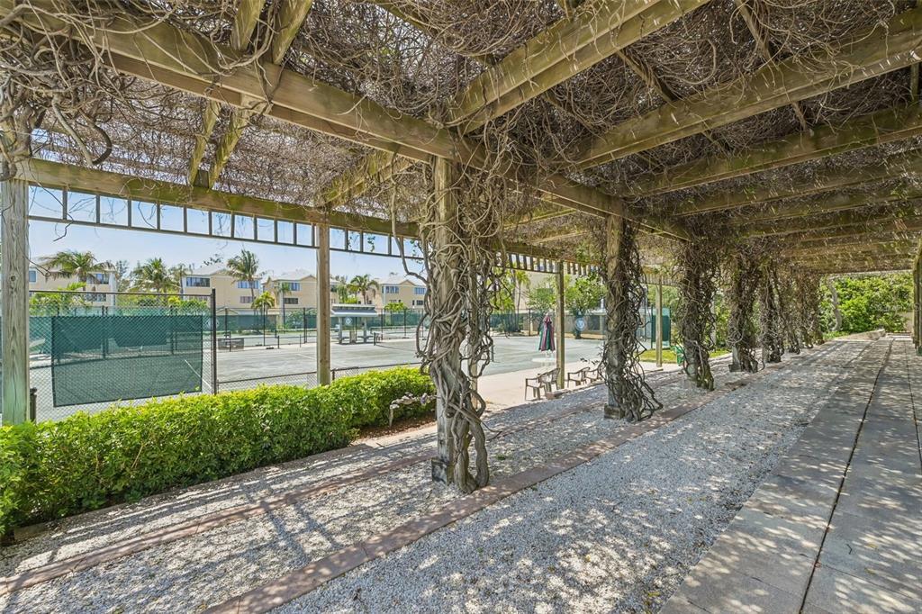 660 Cedars Court Longboat Key, FL 34228 - Photo 31 of 35 a view of a house with a tree in front of it