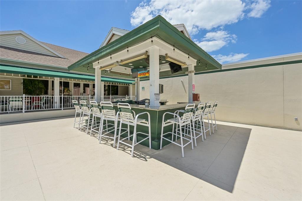660 Cedars Court Longboat Key, FL 34228 - Photo 32 of 35 a view of a patio with table and chairs
