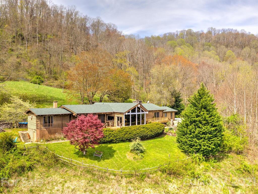 251 Riding High Road Waynesville, NC 28785 - Photo 2 of 41 a front view of house with yard and green space