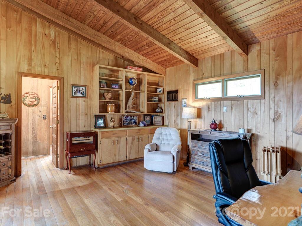 251 Riding High Road Waynesville, NC 28785 - Photo 13 of 41 a living room with furniture and wooden floor