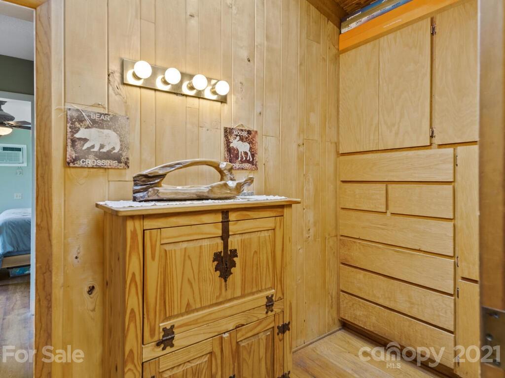 251 Riding High Road Waynesville, NC 28785 - Photo 20 of 41 a bathroom with a sink a vanity and a mirror
