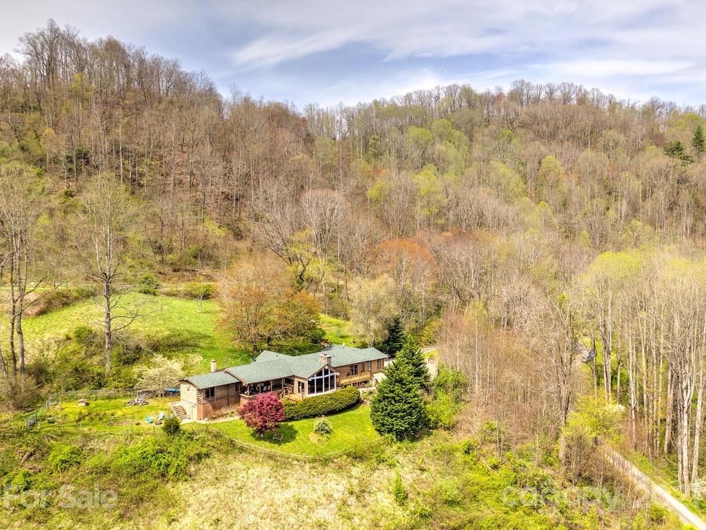 251 Riding High Road Waynesville, NC 28785 - Photo 35 of 41 a view of houses with yard