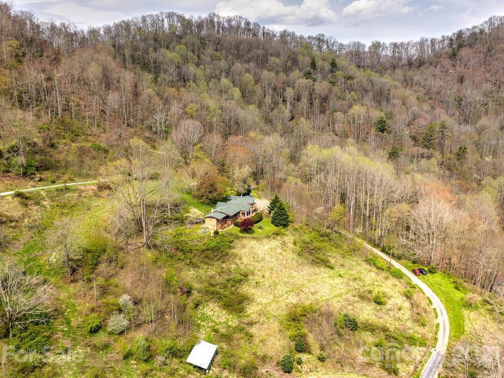 251 Riding High Road Waynesville, NC 28785 - Photo 40 of 41 a view of a swimming pool with a yard