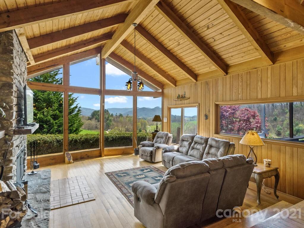 251 Riding High Road Waynesville, NC 28785 - Photo 5 of 41 a living room with furniture and a large window
