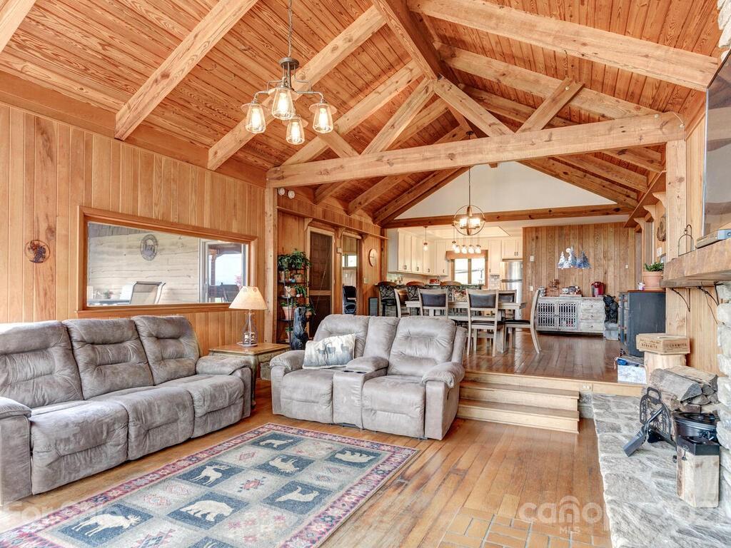 251 Riding High Road Waynesville, NC 28785 - Photo 8 of 41 a living room with furniture and white walls