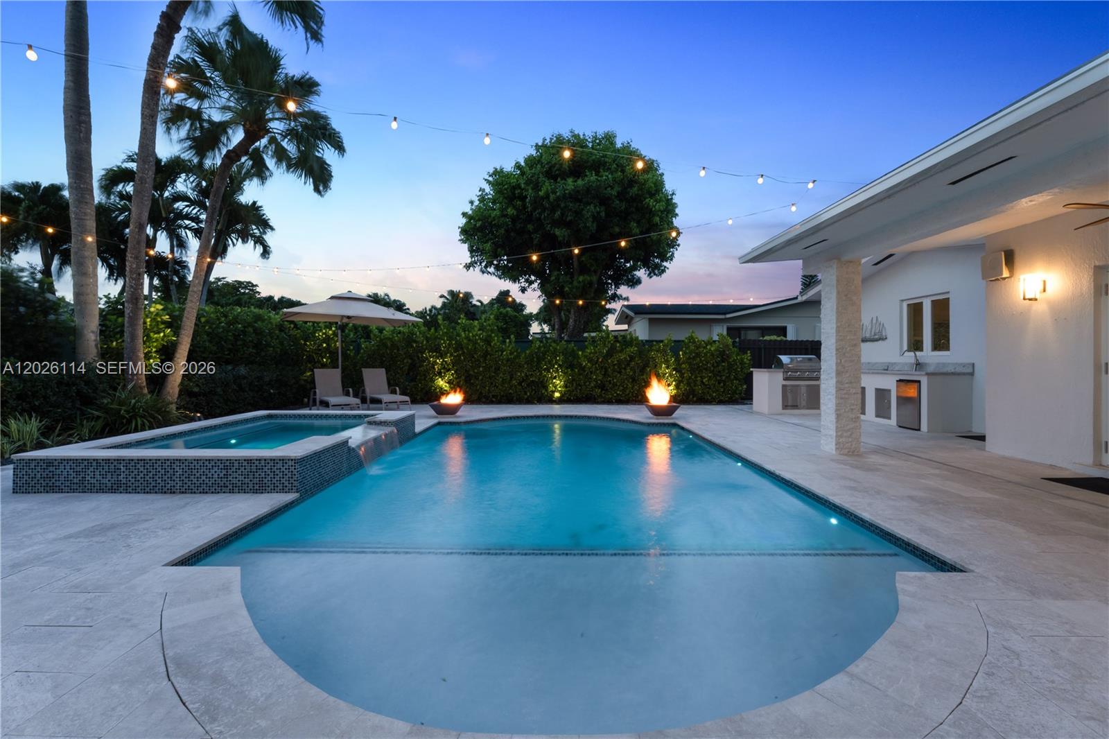 9641 Southwest 66th Street Miami, FL 33173 - Photo 53 of 57 a view of a swimming pool with a patio