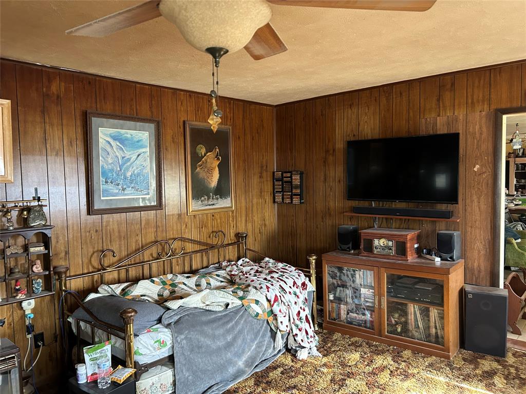 138 Choctaw Trail Whitney, TX 76692 - Photo 13 of 14 a bedroom with bed and a flat screen tv