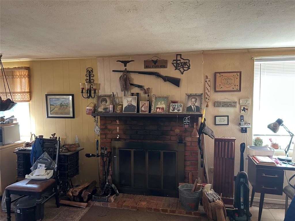 138 Choctaw Trail Whitney, TX 76692 - Photo 8 of 14 a living room with furniture and a fireplace