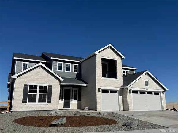 a front view of a house with garage