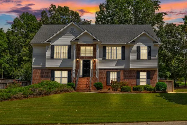 a front view of a house with a yard