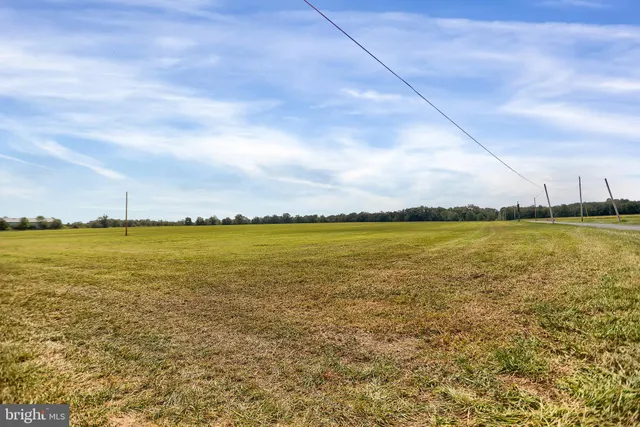 a view of a lake with houses in the back