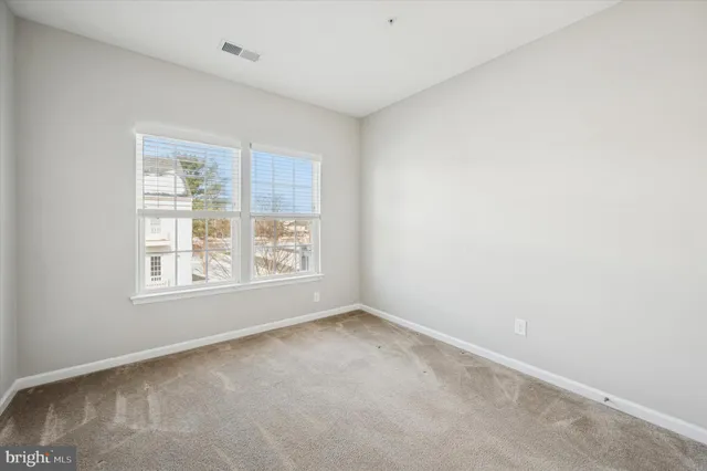 a view of a hallway with wooden shelves