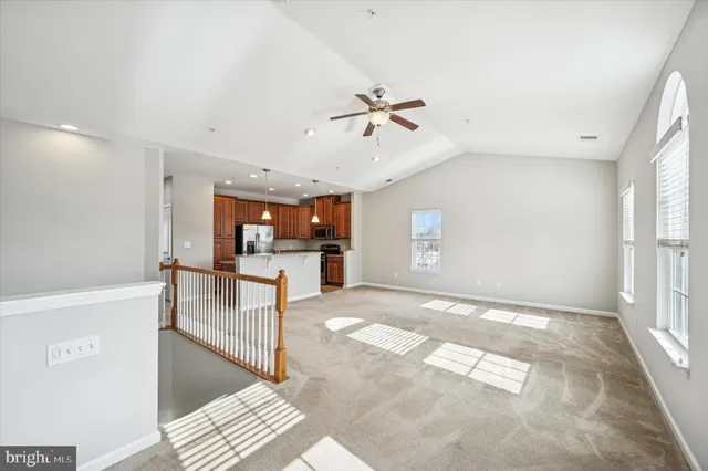 a view of kitchen and hall with wooden floor