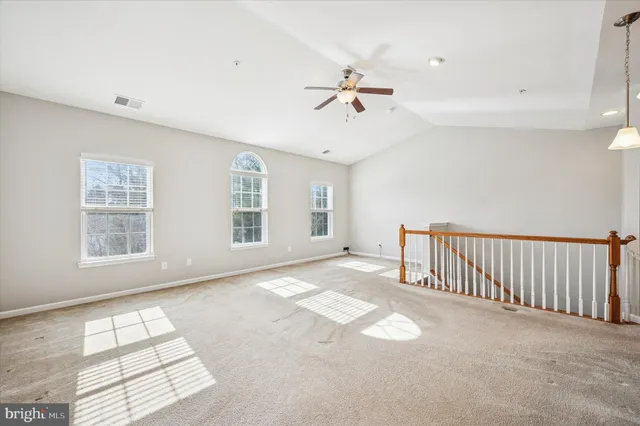 a view of a kitchen with a sink and cabinets