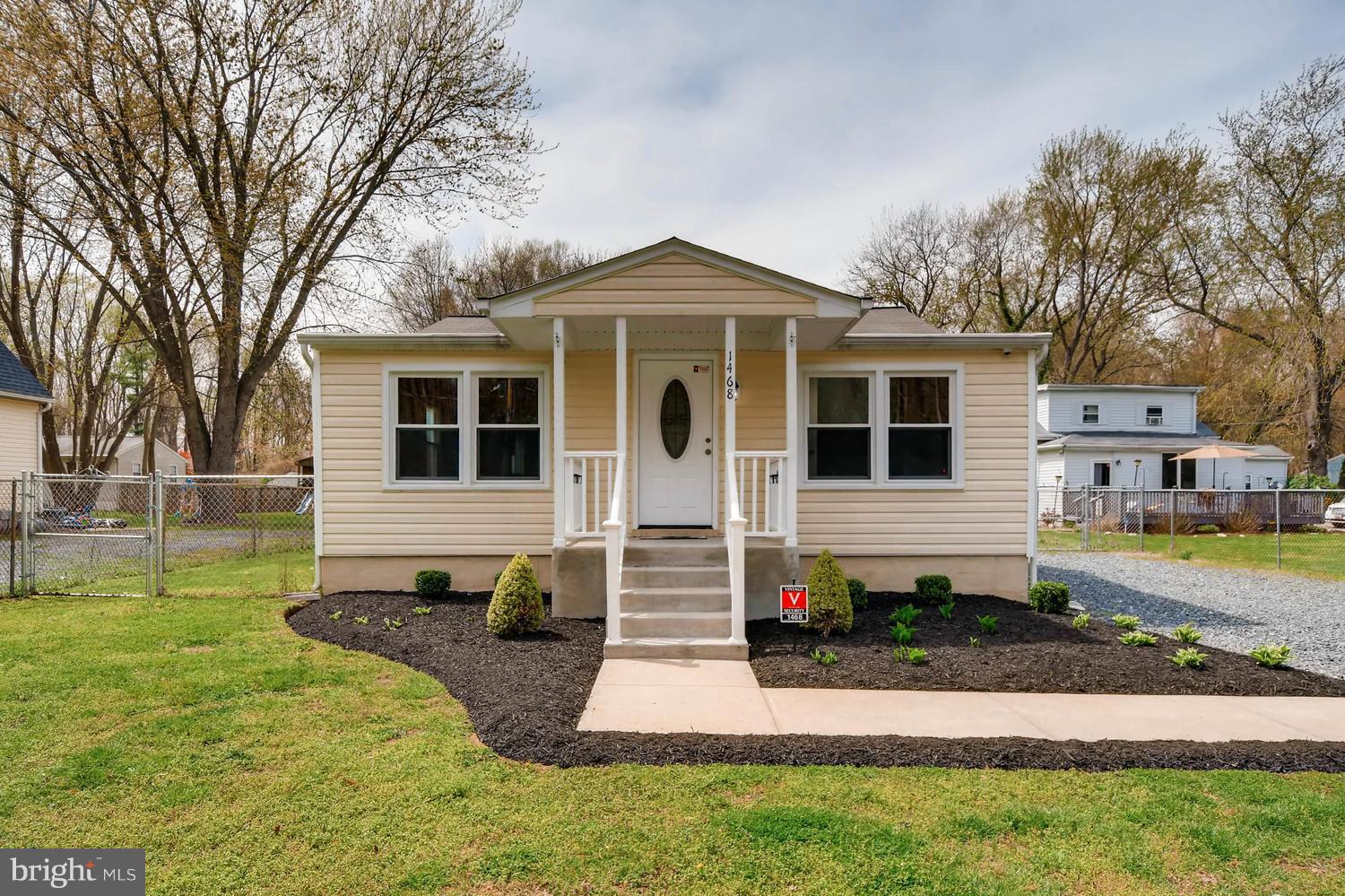 1468 Log Inn Road Annapolis, MD 21409 - Photo 1 of 28 a front view of a house with a yard