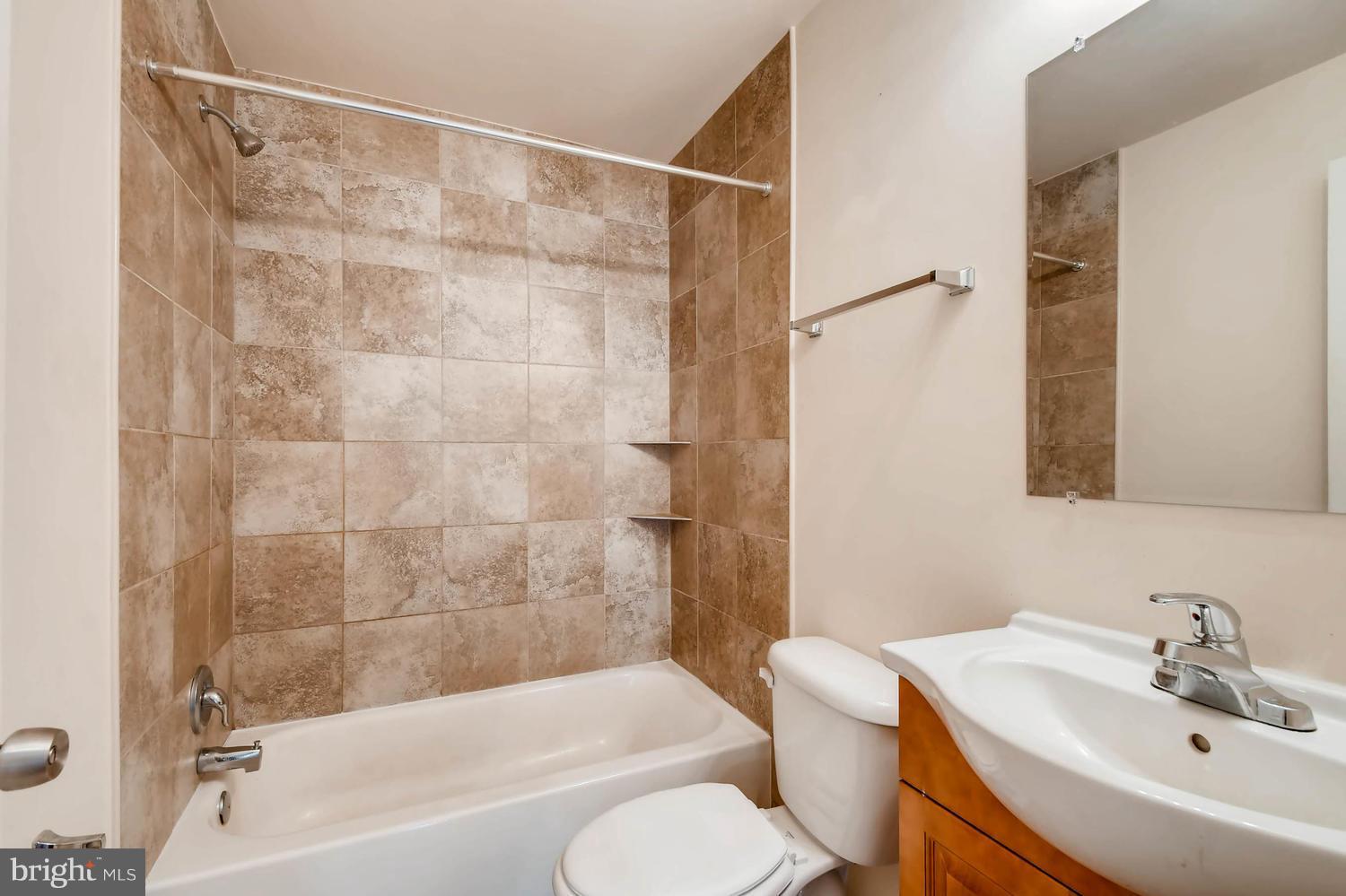 1468 Log Inn Road Annapolis, MD 21409 - Photo 11 of 28 a bathroom with a sink and a bathtub