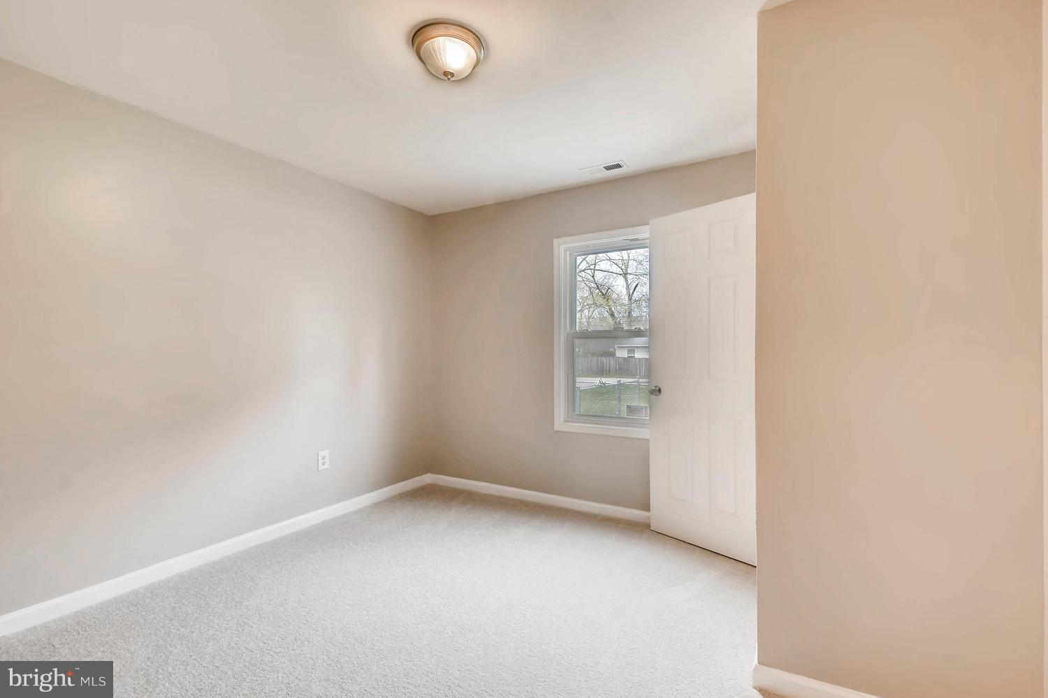 1468 Log Inn Road Annapolis, MD 21409 - Photo 16 of 28 an empty room with windows