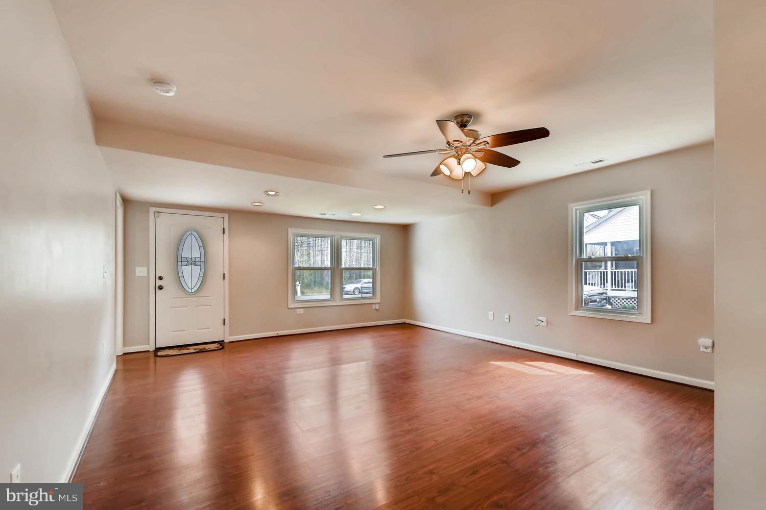 1468 Log Inn Road Annapolis, MD 21409 - Photo 4 of 28 a view of an empty room with wooden floor and a window
