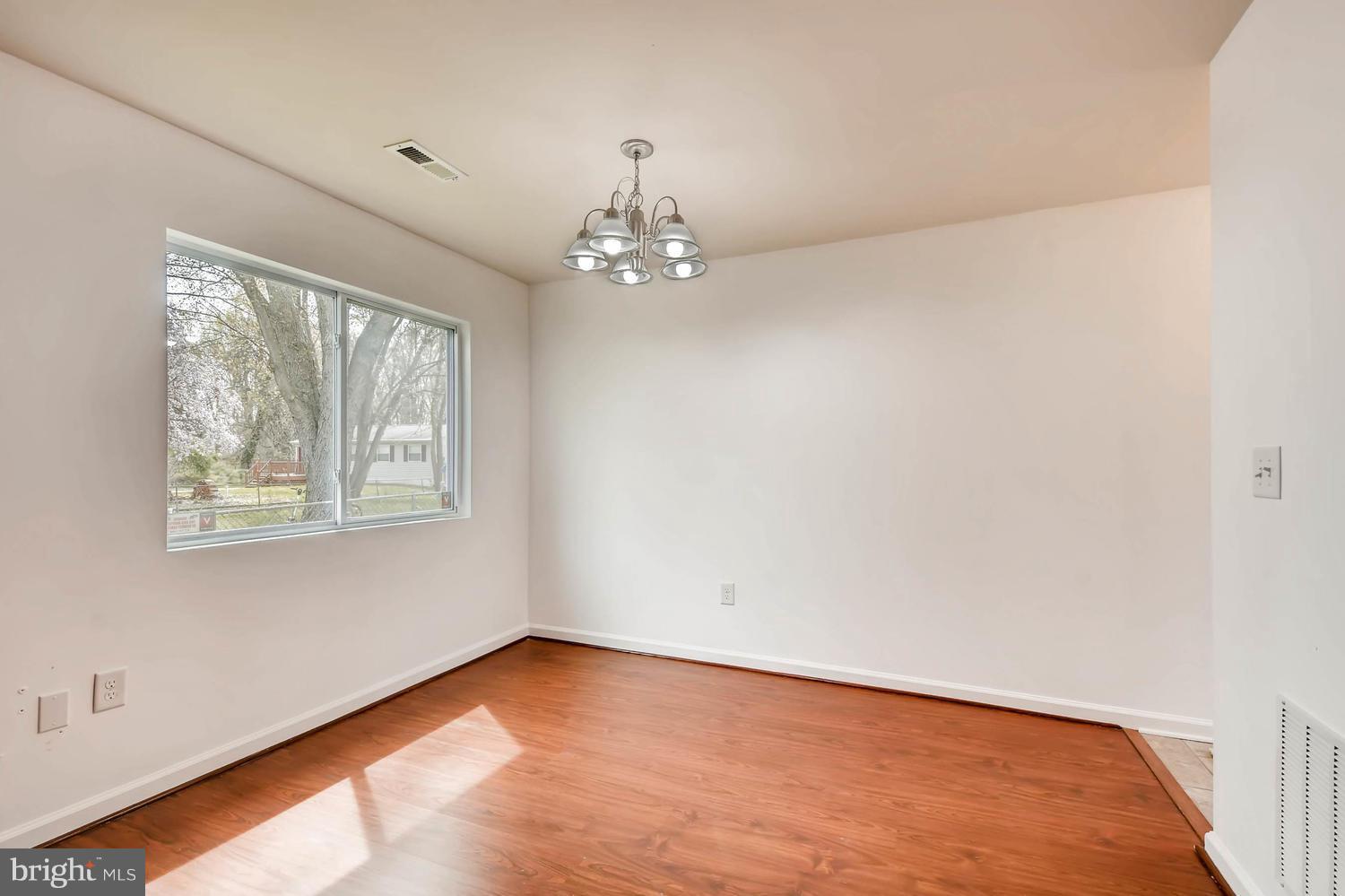 1468 Log Inn Road Annapolis, MD 21409 - Photo 10 of 28 wooden floor in an empty room with a window