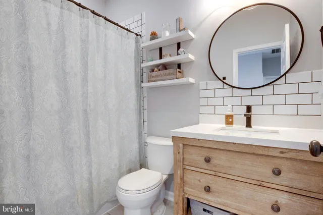 a view of bedroom with furniture and window