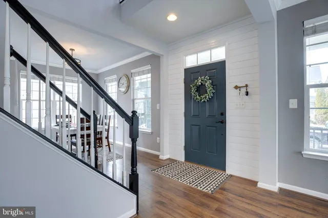 a view of entryway with wooden floor