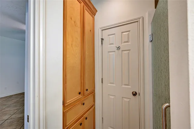 a bathroom with a shower and a door