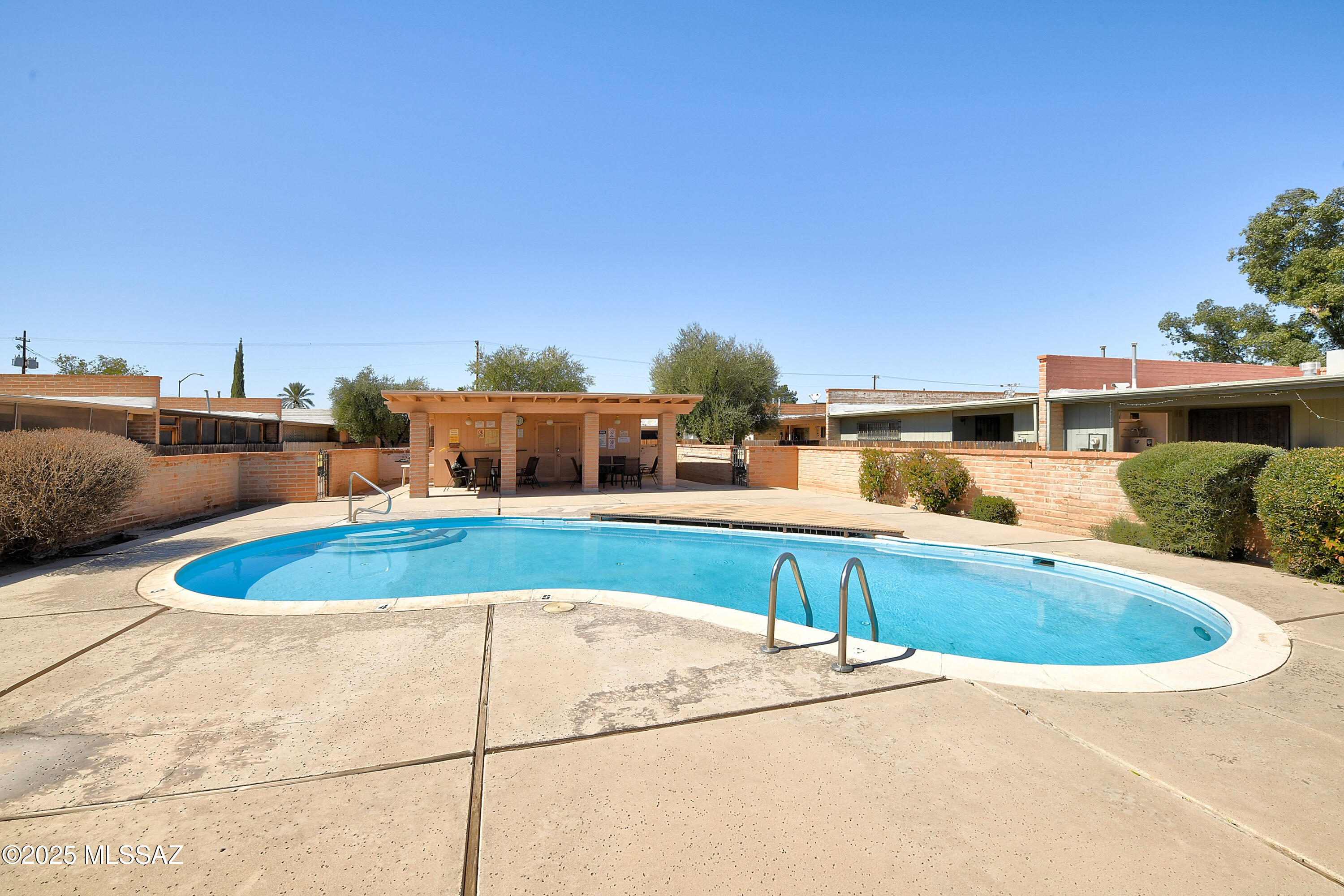 35 East Pastime Road Tucson, AZ 85705 - Photo 22 of 28 a view of a swimming pool with an outdoor seating
