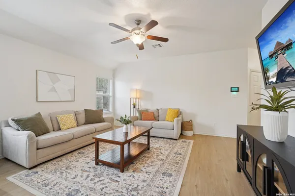 a living room with furniture and a flat screen tv